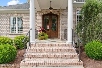 Step into timeless elegance with this stunning custom-built on Reserve Club At St James Plantation in North Carolina - for sale on GolfHomes.com, golf home, golf lot