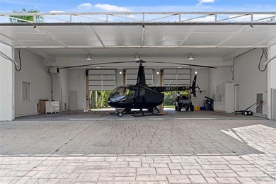 Nestled within the prestigious Wellington Aero Club on a quiet on The Wanderers Club in Florida - for sale on GolfHomes.com, golf home, golf lot