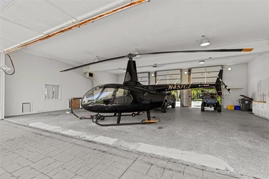 Nestled within the prestigious Wellington Aero Club on a quiet on The Wanderers Club in Florida - for sale on GolfHomes.com, golf home, golf lot