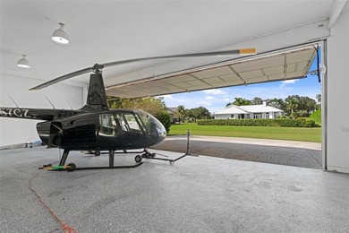 Nestled within the prestigious Wellington Aero Club on a quiet on The Wanderers Club in Florida - for sale on GolfHomes.com, golf home, golf lot
