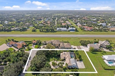 Nestled within the prestigious Wellington Aero Club on a quiet on The Wanderers Club in Florida - for sale on GolfHomes.com, golf home, golf lot
