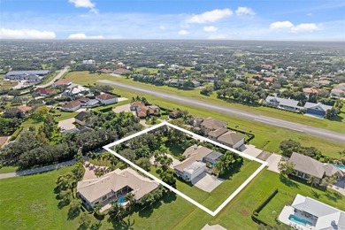Nestled within the prestigious Wellington Aero Club on a quiet on The Wanderers Club in Florida - for sale on GolfHomes.com, golf home, golf lot