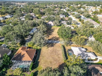 Build your dream home on this large residential lot in the on Harbor Hills Country Club in Florida - for sale on GolfHomes.com, golf home, golf lot