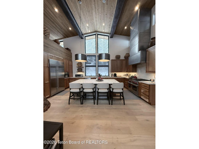 Discover mountain living at its finest at 15465 Tall Timber Rd on Snake River Sporting Club in Wyoming - for sale on GolfHomes.com, golf home, golf lot