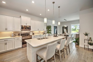 Embrace the epitome of luxury living in this exquisite home with on The Golf Club At Magnolia Landing in Florida - for sale on GolfHomes.com, golf home, golf lot