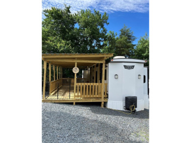 Start Lake Life Today! This 2021 spacious camper 12'x30' covered on Old North State Club at Uwharrie Point Golf community in North Carolina - for sale on GolfHomes.com, golf home, golf lot