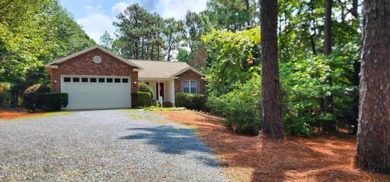 Single story living tucked away amidst mature crepe myrtle & on Seven Lakes Country Club in North Carolina - for sale on GolfHomes.com, golf home, golf lot