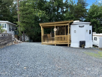 Start Lake Life Today! This 2021 spacious camper 12'x30' covered on Old North State Club at Uwharrie Point Golf community in North Carolina - for sale on GolfHomes.com, golf home, golf lot