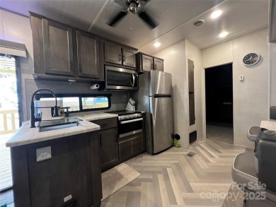 Start Lake Life Today! This 2021 spacious camper 12'x30' covered on Old North State Club at Uwharrie Point Golf community in North Carolina - for sale on GolfHomes.com, golf home, golf lot