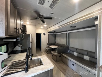 Start Lake Life Today! This 2021 spacious camper 12'x30' covered on Old North State Club at Uwharrie Point Golf community in North Carolina - for sale on GolfHomes.com, golf home, golf lot