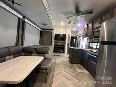 Start Lake Life Today! This 2021 spacious camper 12'x30' covered on Old North State Club at Uwharrie Point Golf community in North Carolina - for sale on GolfHomes.com, golf home, golf lot