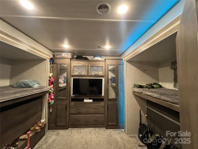 Start Lake Life Today! This 2021 spacious camper 12'x30' covered on Old North State Club at Uwharrie Point Golf community in North Carolina - for sale on GolfHomes.com, golf home, golf lot