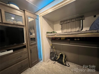 Start Lake Life Today! This 2021 spacious camper 12'x30' covered on Old North State Club at Uwharrie Point Golf community in North Carolina - for sale on GolfHomes.com, golf home, golf lot