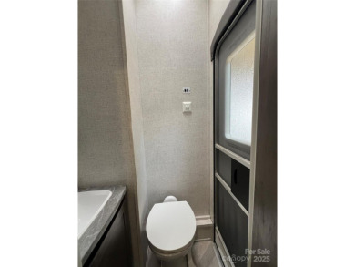 Start Lake Life Today! This 2021 spacious camper 12'x30' covered on Old North State Club at Uwharrie Point Golf community in North Carolina - for sale on GolfHomes.com, golf home, golf lot