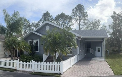 This has says WOW as you pull up to the gorgeously landscaped on Golden Lakes Golf Course in Florida - for sale on GolfHomes.com, golf home, golf lot