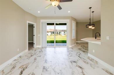 One or more photos have been virtually staged.  NEW CONSTRUCTION on Oyster Creek Golf Club in Florida - for sale on GolfHomes.com, golf home, golf lot