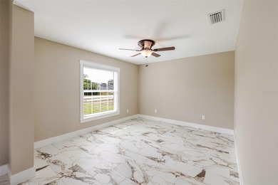 One or more photos have been virtually staged.  NEW CONSTRUCTION on Oyster Creek Golf Club in Florida - for sale on GolfHomes.com, golf home, golf lot