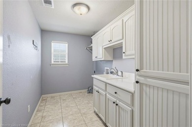 This beautifully updated Alma home offers a refined blend of on Eagle Crest Golf Course in Arkansas - for sale on GolfHomes.com, golf home, golf lot