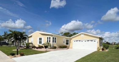 This beautiful stucco Casa Grande 2bd/2ba + Family room home is on Del Tura Golf and Country Club in Florida - for sale on GolfHomes.com, golf home, golf lot