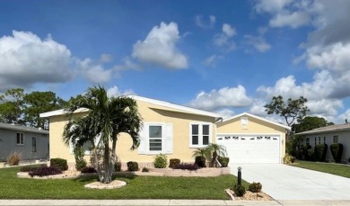 This beautiful stucco Casa Grande 2bd/2ba + Family room home is on Del Tura Golf and Country Club in Florida - for sale on GolfHomes.com, golf home, golf lot