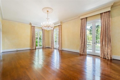 Situated on two lots with nearly an acre of land in one of the on Country Club of Mobile in Alabama - for sale on GolfHomes.com, golf home, golf lot