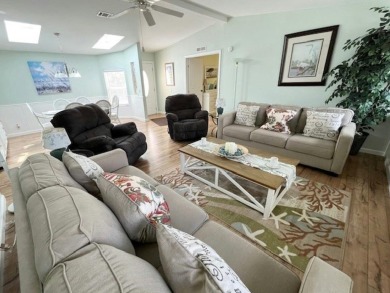 This beautiful stucco Casa Grande 2bd/2ba + Family room home is on Del Tura Golf and Country Club in Florida - for sale on GolfHomes.com, golf home, golf lot