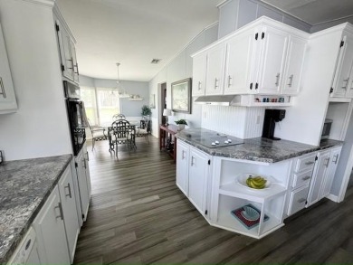 Beautifully updated 2bd/2ba coastal-inspired home. Featuring on Del Tura Golf and Country Club in Florida - for sale on GolfHomes.com, golf home, golf lot