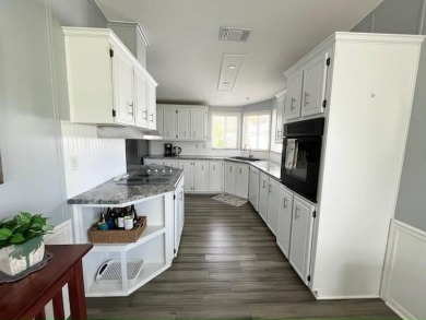 Beautifully updated 2bd/2ba coastal-inspired home. Featuring on Del Tura Golf and Country Club in Florida - for sale on GolfHomes.com, golf home, golf lot