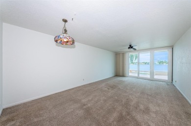 RARELY available 1st floor condo. Overlooking the intracoastal on Isla Del Sol Yacht and Country Club in Florida - for sale on GolfHomes.com, golf home, golf lot