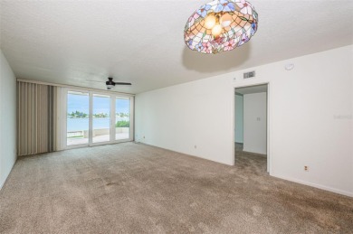 RARELY available 1st floor condo. Overlooking the intracoastal on Isla Del Sol Yacht and Country Club in Florida - for sale on GolfHomes.com, golf home, golf lot