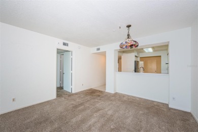 RARELY available 1st floor condo. Overlooking the intracoastal on Isla Del Sol Yacht and Country Club in Florida - for sale on GolfHomes.com, golf home, golf lot