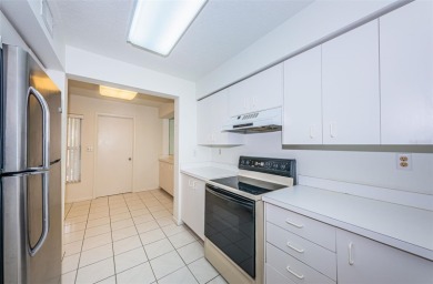 RARELY available 1st floor condo. Overlooking the intracoastal on Isla Del Sol Yacht and Country Club in Florida - for sale on GolfHomes.com, golf home, golf lot