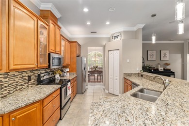 This stunning former builder's model home by Robinshore is on Haile Plantation Golf and Country Club in Florida - for sale on GolfHomes.com, golf home, golf lot