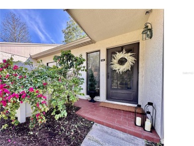 WELCOME to this bright and spacious villa located in the HIGHLY on East Lake Woodlands Country Club in Florida - for sale on GolfHomes.com, golf home, golf lot