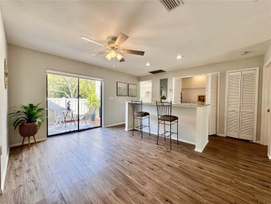 WELCOME to this bright and spacious villa located in the HIGHLY on East Lake Woodlands Country Club in Florida - for sale on GolfHomes.com, golf home, golf lot