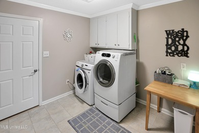 Move-in ready and beautifully updated, this 4-bedroom, 2-bath on Colonial Country Club Deerfield in Mississippi - for sale on GolfHomes.com, golf home, golf lot