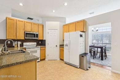 Welcome to this charming and cozy 4-bedroom, 3-bath home located on Julington Creek Golf Club in Florida - for sale on GolfHomes.com, golf home, golf lot