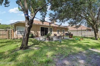 Welcome to this charming and cozy 4-bedroom, 3-bath home located on Julington Creek Golf Club in Florida - for sale on GolfHomes.com, golf home, golf lot