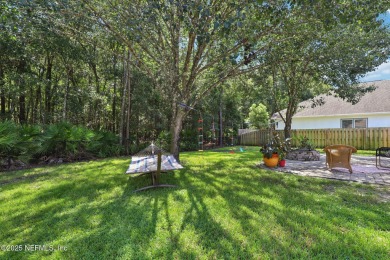 Welcome to this charming and cozy 4-bedroom, 3-bath home located on Julington Creek Golf Club in Florida - for sale on GolfHomes.com, golf home, golf lot
