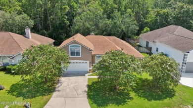 Welcome to this charming and cozy 4-bedroom, 3-bath home located on Julington Creek Golf Club in Florida - for sale on GolfHomes.com, golf home, golf lot