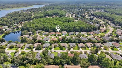 Welcome to this charming and cozy 4-bedroom, 3-bath home located on Julington Creek Golf Club in Florida - for sale on GolfHomes.com, golf home, golf lot