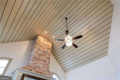 Welcome to 6186 Talmadge Run-an elegant retreat tucked inside on The Governors Towne Club in Georgia - for sale on GolfHomes.com, golf home, golf lot