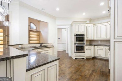 Welcome to 6186 Talmadge Run-an elegant retreat tucked inside on The Governors Towne Club in Georgia - for sale on GolfHomes.com, golf home, golf lot