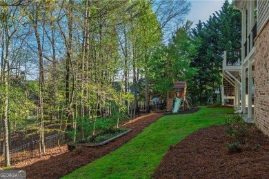 Welcome to 6186 Talmadge Run-an elegant retreat tucked inside on The Governors Towne Club in Georgia - for sale on GolfHomes.com, golf home, golf lot