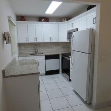Don't miss this conveniently located updated 1st floor corner on Kings Point Golf - Executive in Florida - for sale on GolfHomes.com, golf home, golf lot