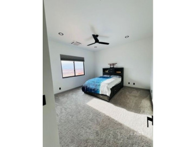 This exquisite estate, perfectly perched to offer panoramic on Lake Powell National Golf Course in Arizona - for sale on GolfHomes.com, golf home, golf lot