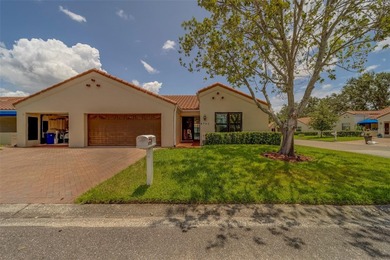 Welcome home to this light and airy 2 bedroom/2 bathroom corner on Mainlands Golf Club in Florida - for sale on GolfHomes.com, golf home, golf lot