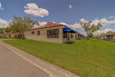Welcome home to this light and airy 2 bedroom/2 bathroom corner on Mainlands Golf Club in Florida - for sale on GolfHomes.com, golf home, golf lot