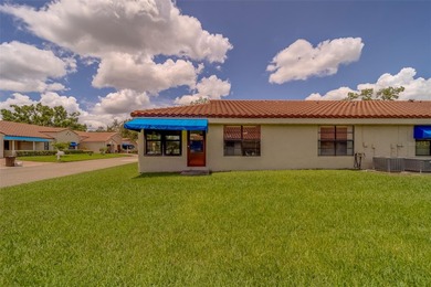 Welcome home to this light and airy 2 bedroom/2 bathroom corner on Mainlands Golf Club in Florida - for sale on GolfHomes.com, golf home, golf lot