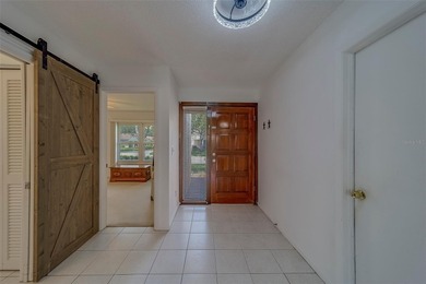 Welcome home to this light and airy 2 bedroom/2 bathroom corner on Mainlands Golf Club in Florida - for sale on GolfHomes.com, golf home, golf lot
